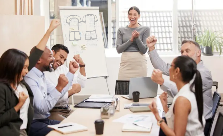 a group of people in a meeting